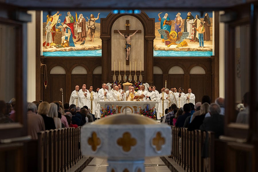 priests at the altar in a church